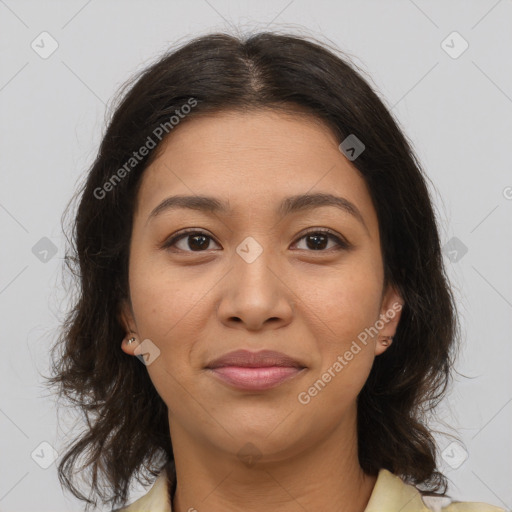 Joyful latino young-adult female with medium  brown hair and brown eyes