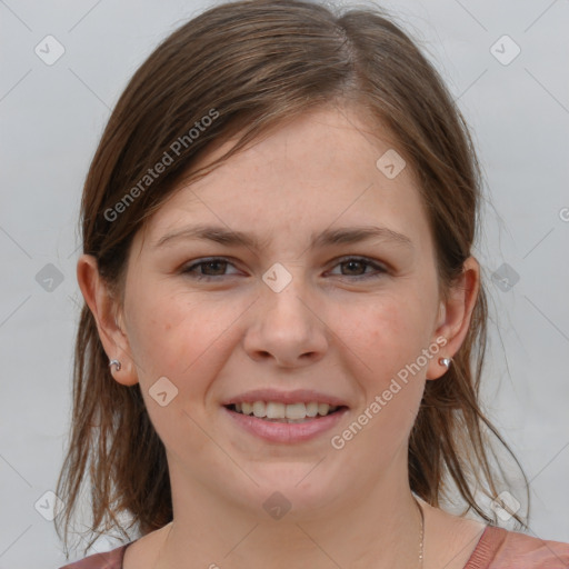 Joyful white young-adult female with medium  brown hair and grey eyes