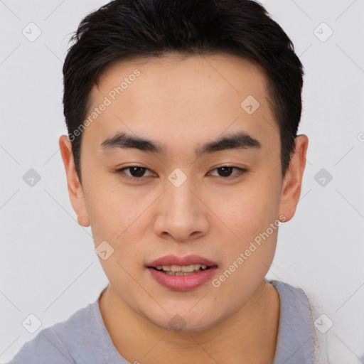 Joyful asian young-adult male with short  black hair and brown eyes