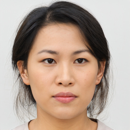 Neutral asian young-adult female with medium  brown hair and brown eyes