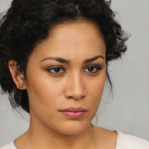 Neutral latino young-adult female with medium  brown hair and brown eyes