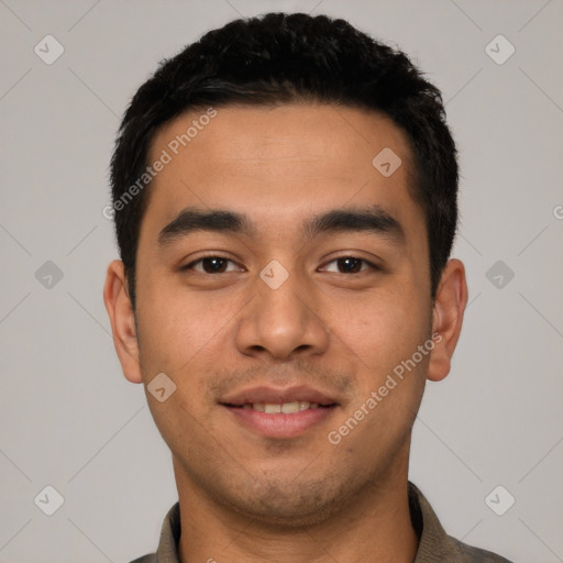 Joyful latino young-adult male with short  black hair and brown eyes