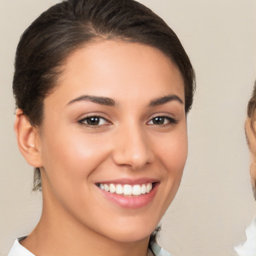 Joyful white young-adult female with medium  brown hair and brown eyes