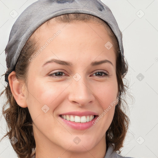 Joyful white young-adult female with medium  brown hair and blue eyes