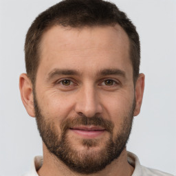 Joyful white young-adult male with short  brown hair and brown eyes