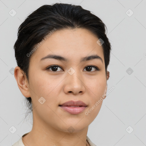 Joyful latino young-adult female with medium  brown hair and brown eyes