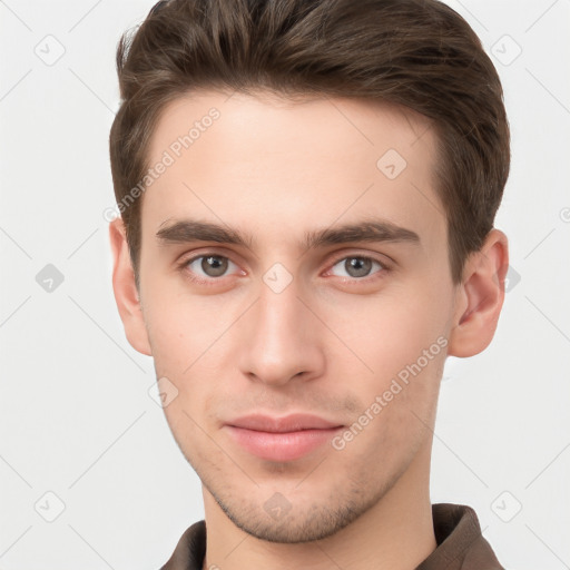 Neutral white young-adult male with short  brown hair and grey eyes