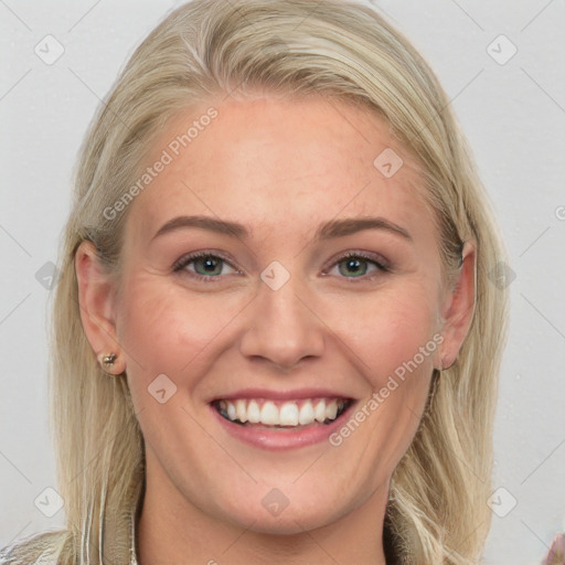 Joyful white young-adult female with long  brown hair and blue eyes