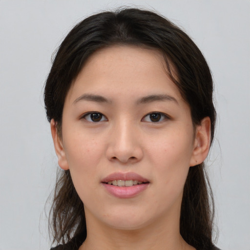 Joyful asian young-adult female with medium  brown hair and brown eyes