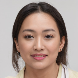 Joyful white young-adult female with medium  brown hair and brown eyes