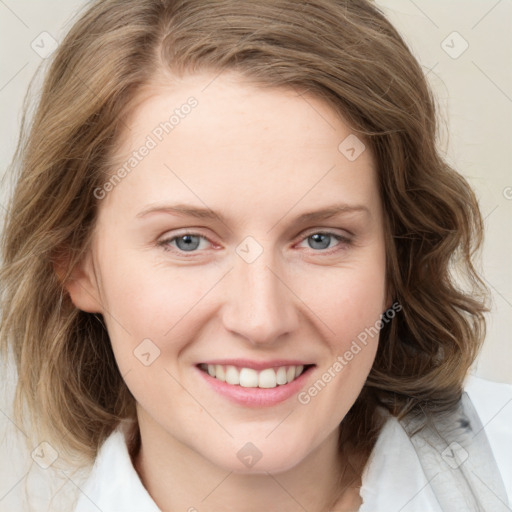 Joyful white young-adult female with medium  brown hair and blue eyes