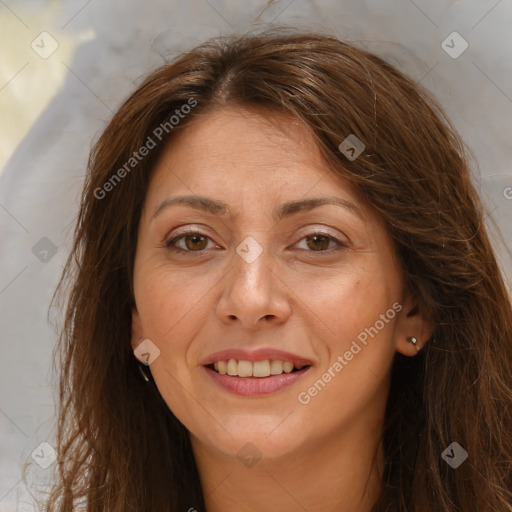 Joyful white adult female with long  brown hair and brown eyes