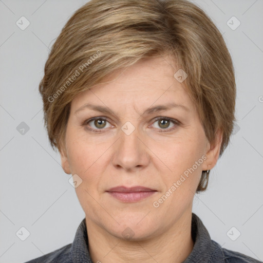 Joyful white adult female with short  brown hair and grey eyes