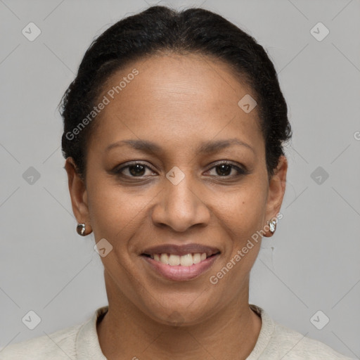 Joyful black adult female with short  brown hair and brown eyes