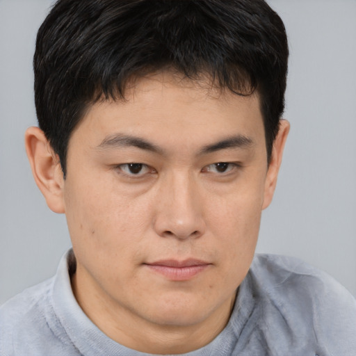 Neutral asian young-adult male with short  brown hair and brown eyes