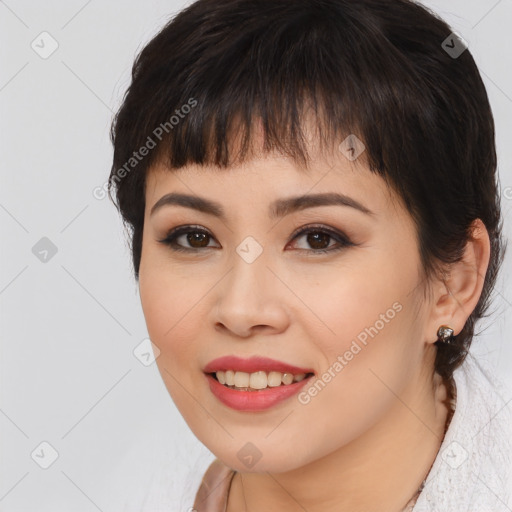 Joyful asian young-adult female with medium  brown hair and brown eyes