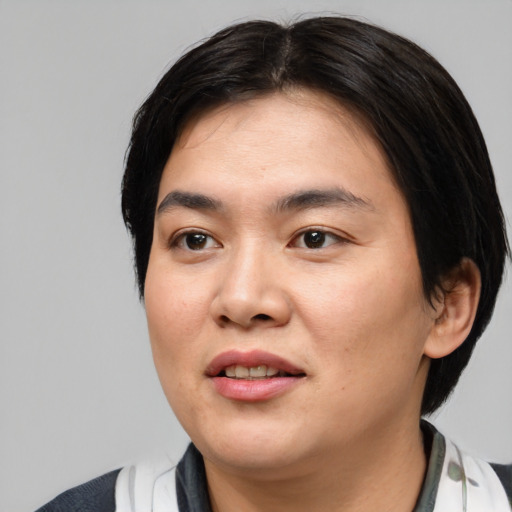 Joyful asian young-adult female with medium  black hair and brown eyes