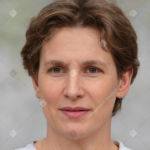 Joyful white adult female with short  brown hair and brown eyes