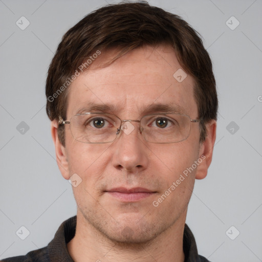 Joyful white adult male with short  brown hair and grey eyes