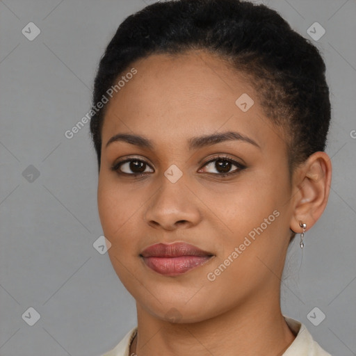 Joyful black young-adult female with short  brown hair and brown eyes