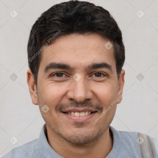 Joyful white young-adult male with short  black hair and brown eyes