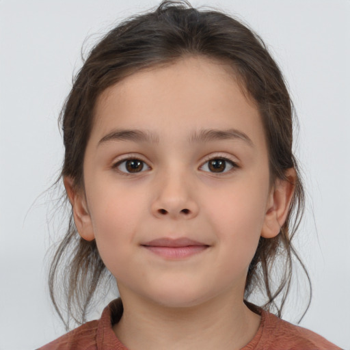 Joyful white child female with medium  brown hair and brown eyes