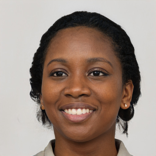 Joyful latino young-adult female with medium  black hair and brown eyes