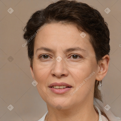 Joyful white adult female with short  brown hair and brown eyes