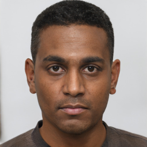 Neutral black young-adult male with short  brown hair and brown eyes
