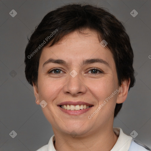 Joyful white adult female with short  brown hair and brown eyes