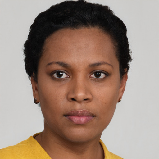 Neutral black young-adult female with short  black hair and brown eyes