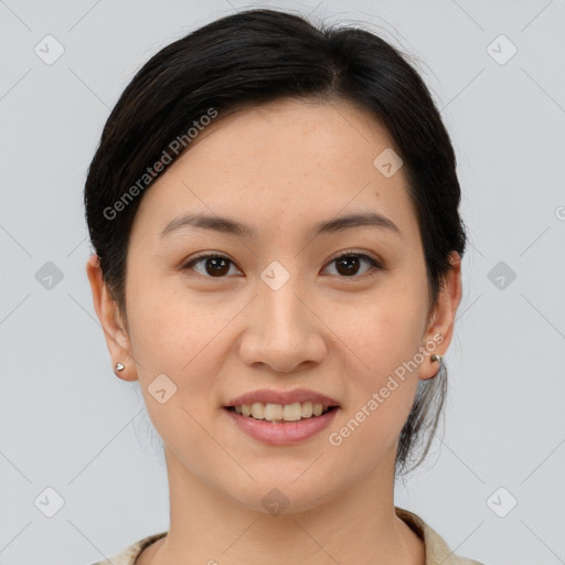 Joyful asian young-adult female with medium  brown hair and brown eyes