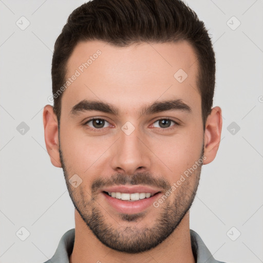 Joyful white young-adult male with short  brown hair and brown eyes