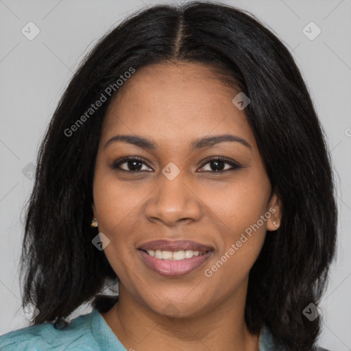 Joyful black young-adult female with long  black hair and brown eyes