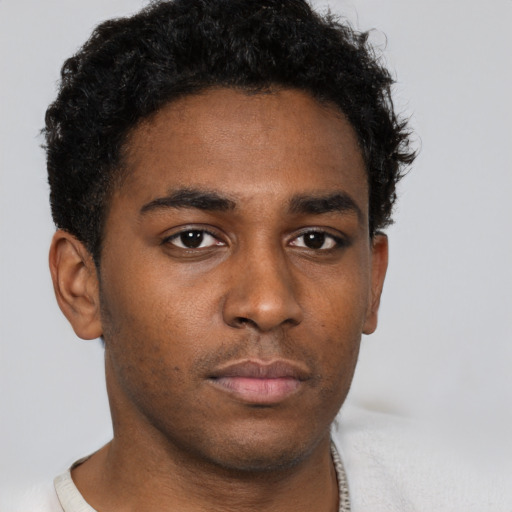 Neutral black young-adult male with short  brown hair and brown eyes