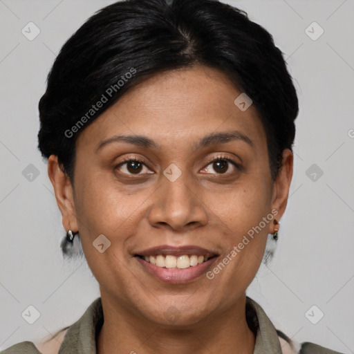 Joyful latino adult female with short  brown hair and brown eyes