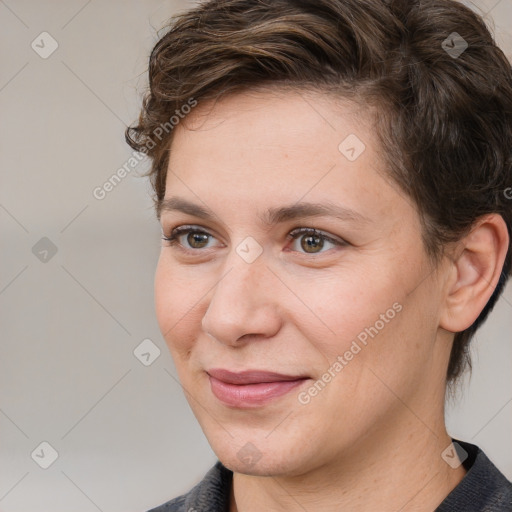 Joyful white adult female with medium  brown hair and grey eyes