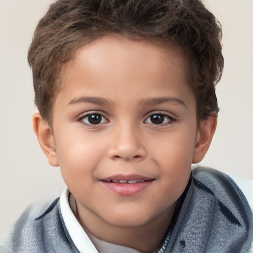 Joyful white child male with short  brown hair and brown eyes