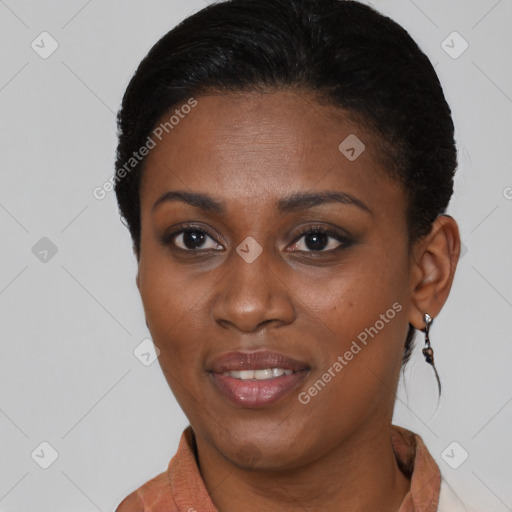 Joyful black young-adult female with short  brown hair and brown eyes