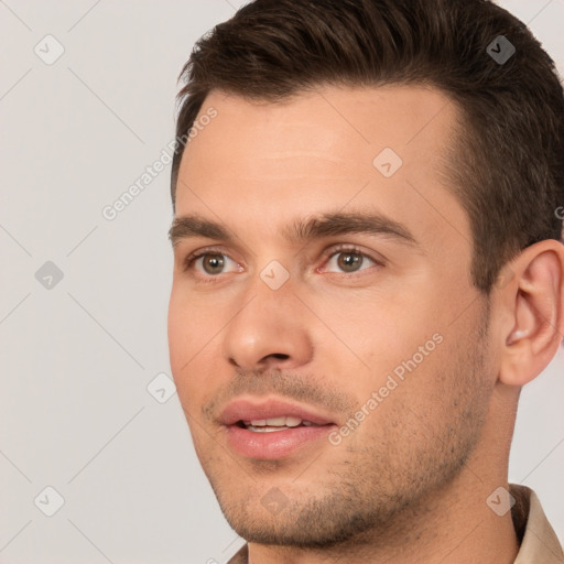 Joyful white young-adult male with short  brown hair and brown eyes