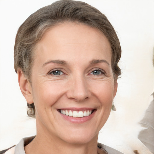 Joyful white adult female with short  brown hair and brown eyes