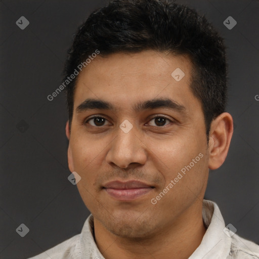 Joyful latino young-adult male with short  brown hair and brown eyes