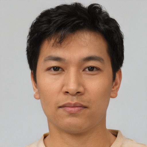 Neutral asian young-adult male with short  black hair and brown eyes