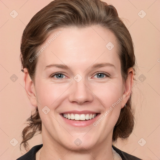 Joyful white young-adult female with medium  brown hair and grey eyes