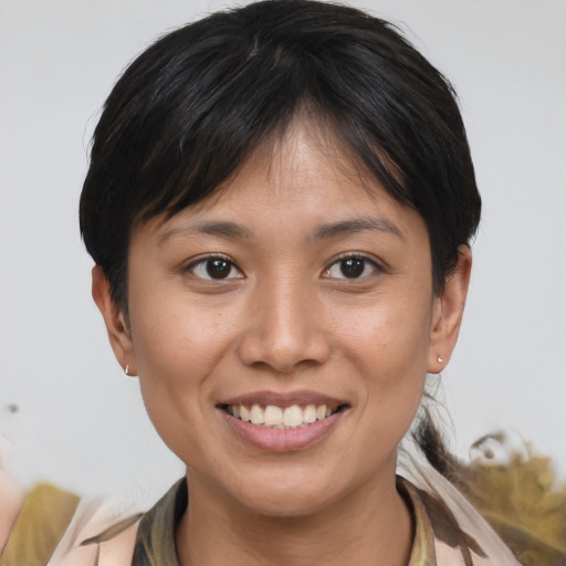 Joyful asian young-adult female with short  brown hair and brown eyes