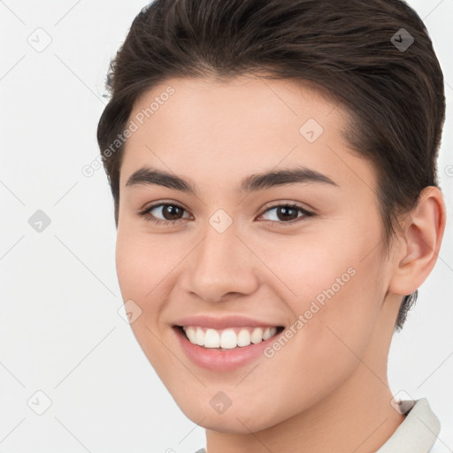 Joyful white young-adult female with short  brown hair and brown eyes