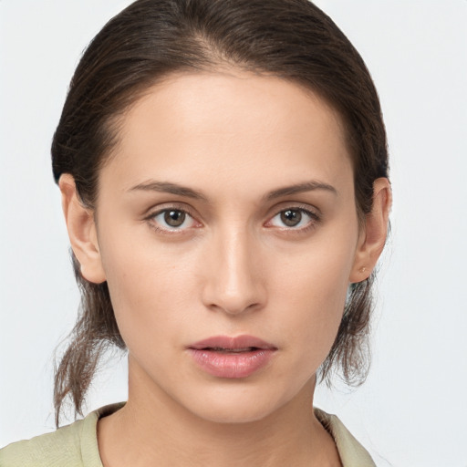 Neutral white young-adult female with medium  brown hair and brown eyes