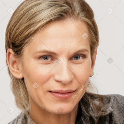 Joyful white adult female with medium  brown hair and grey eyes