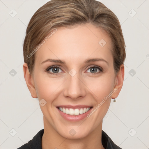 Joyful white young-adult female with short  brown hair and grey eyes