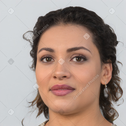 Joyful latino young-adult female with long  brown hair and brown eyes